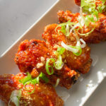 korean fried chicken made in air fryer with spicy sauce