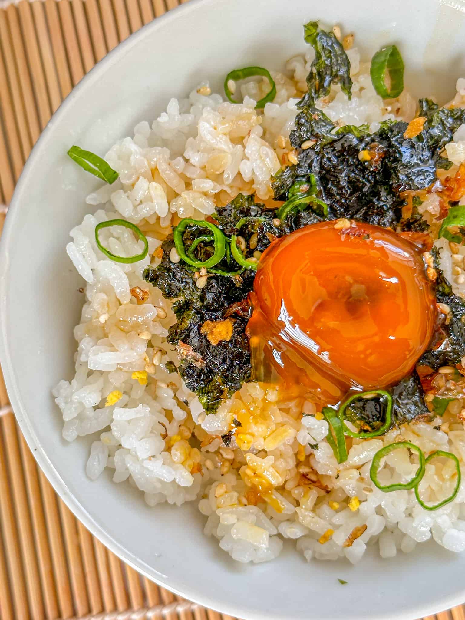 soy cured egg yolks with hot white rice seaweed, green onions, and furikake