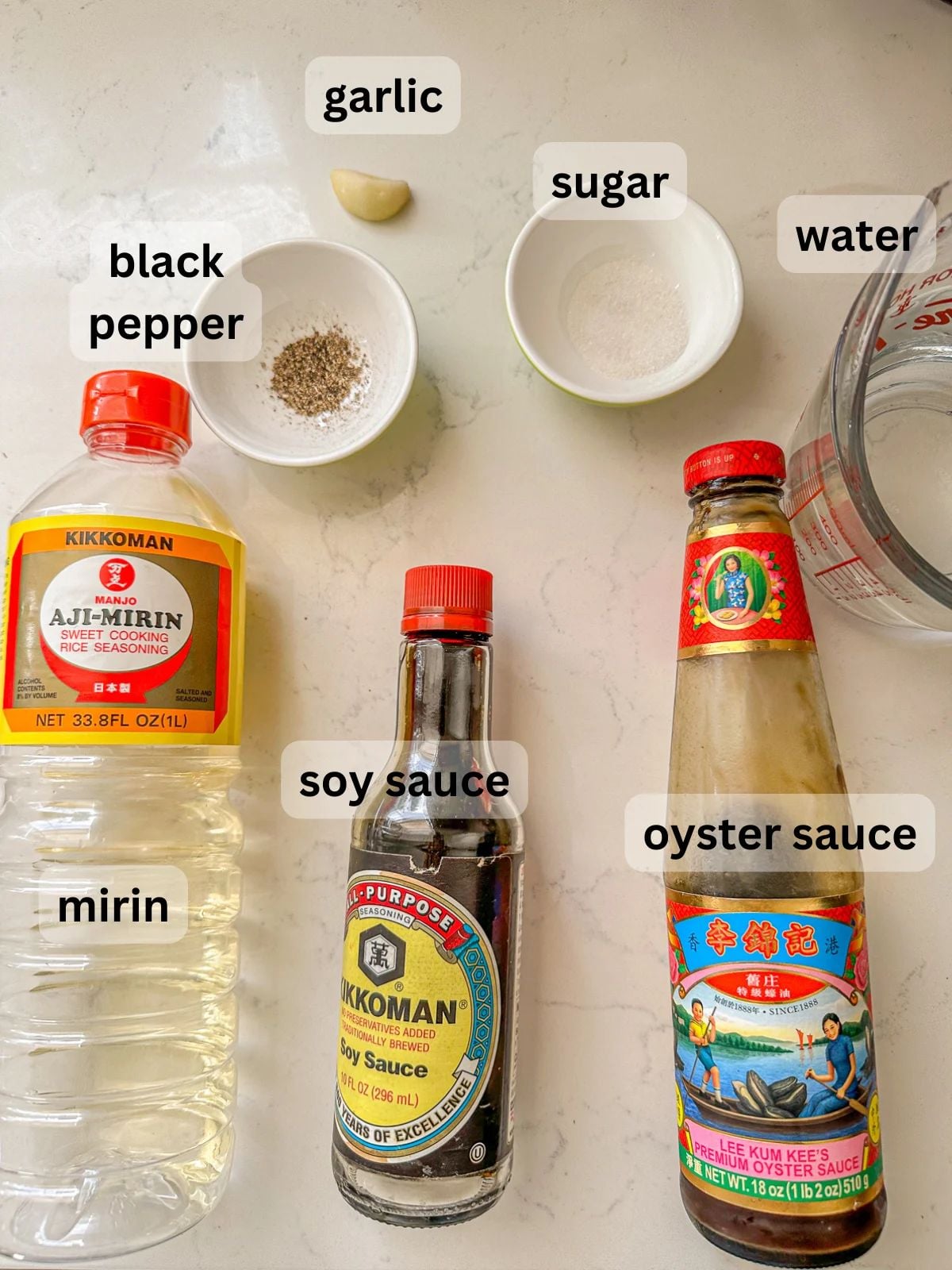 Ingredients with garlic, sugar, water, black pepper, mirin, soy sauce, and oyster sauce.
