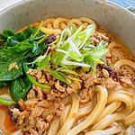 udon noodles with chicken and pork broth, pork mince, green onions and spinach
