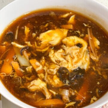 A bowl full of hot and sour soup.
