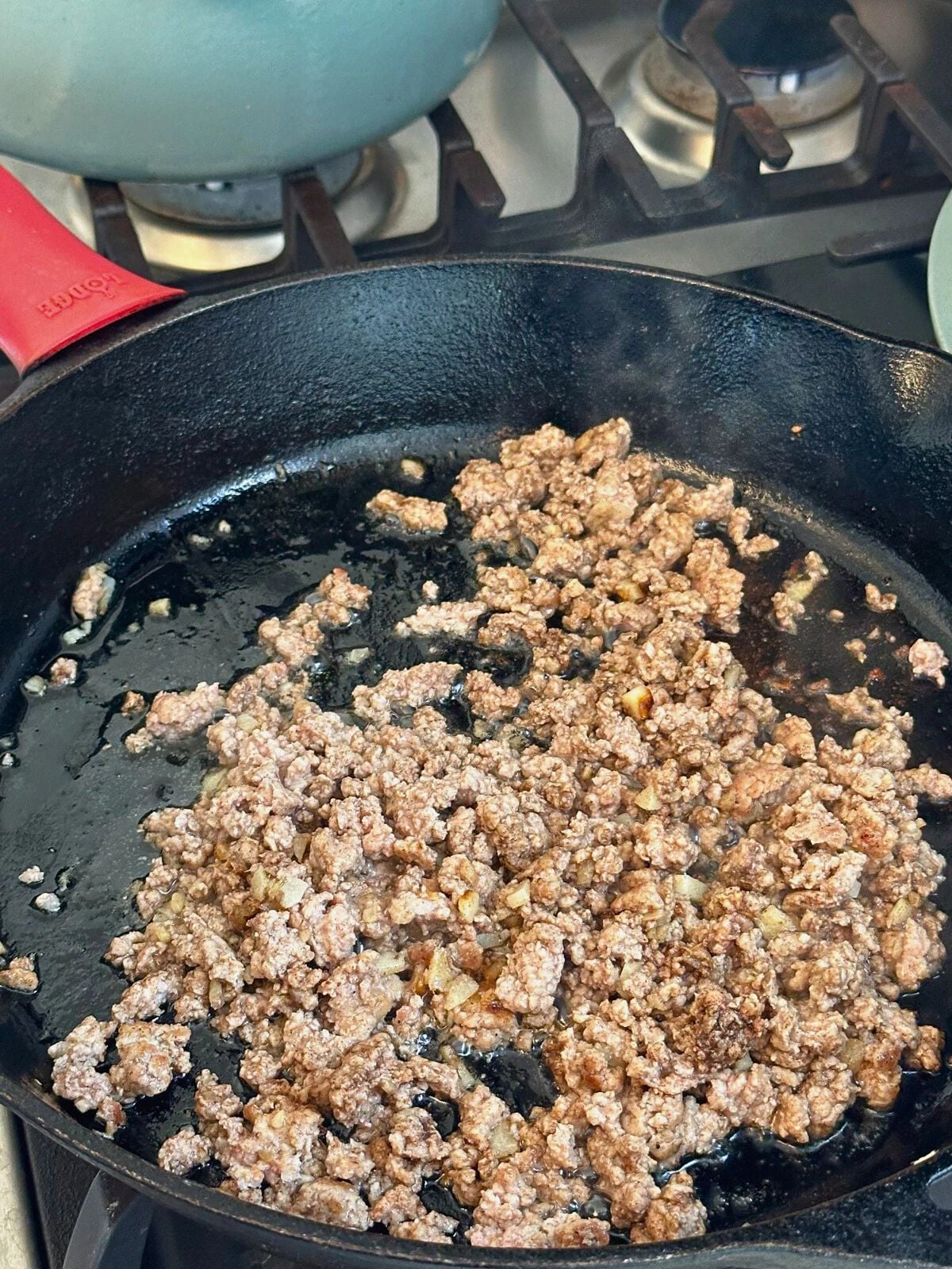 Sauteed ground pork in a pan.