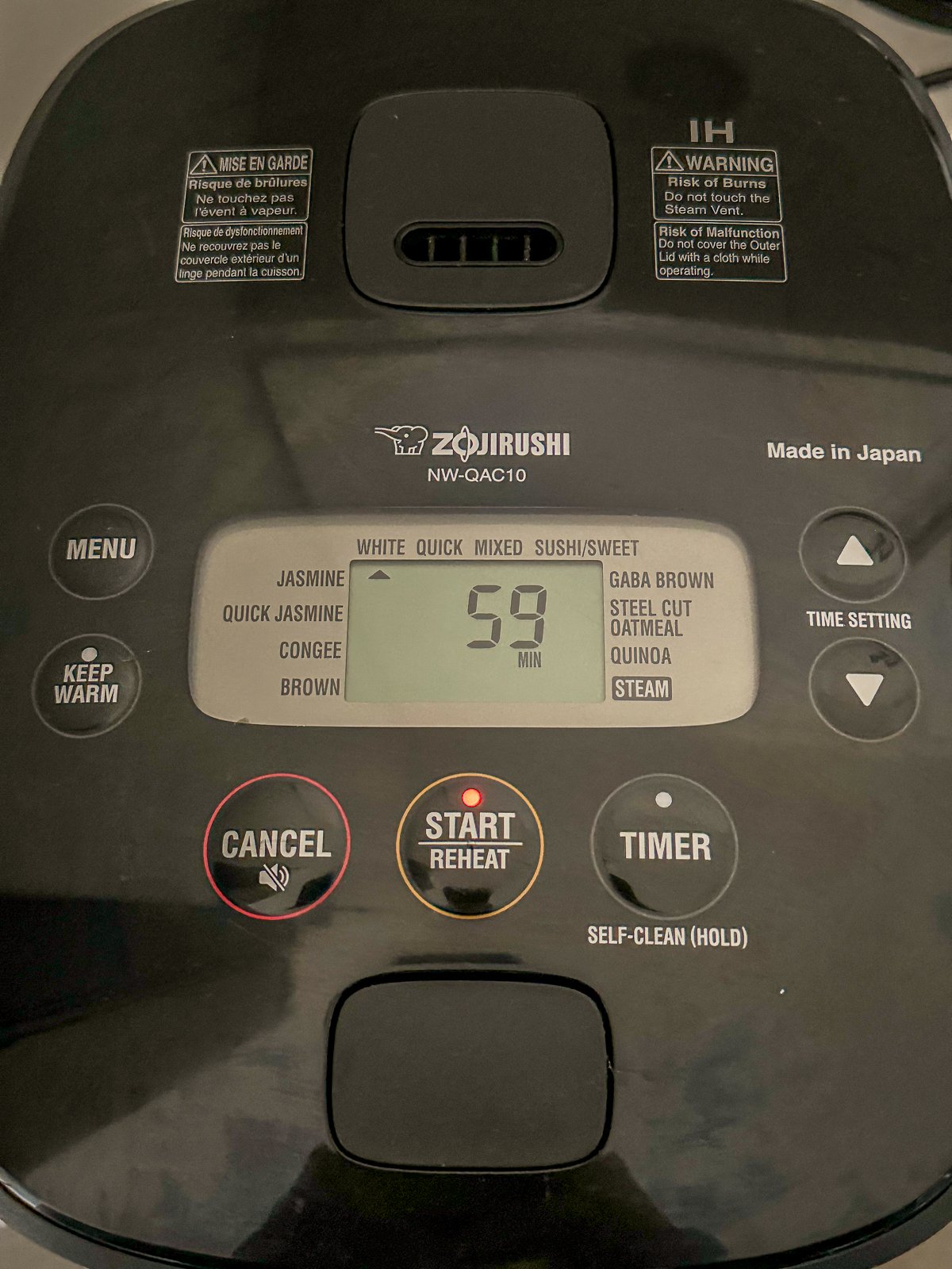 Rice cooker cooking chicken.