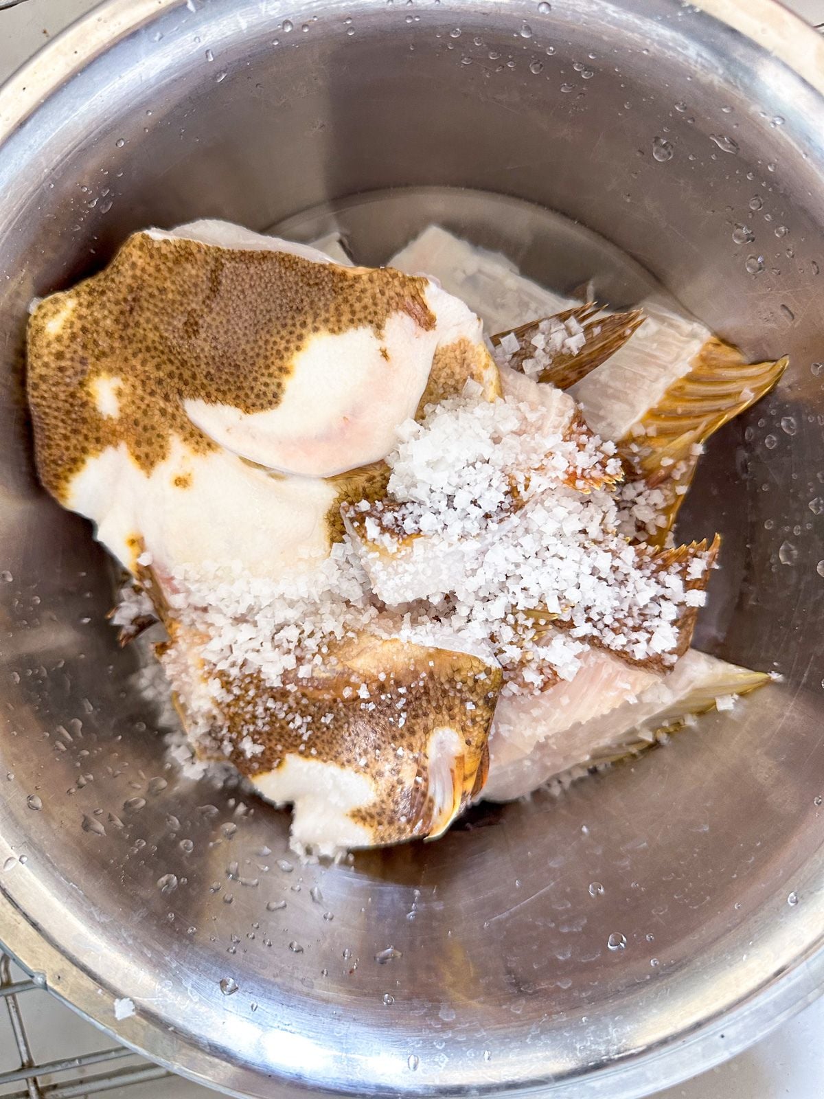 Fish bones in a bowl with salt.