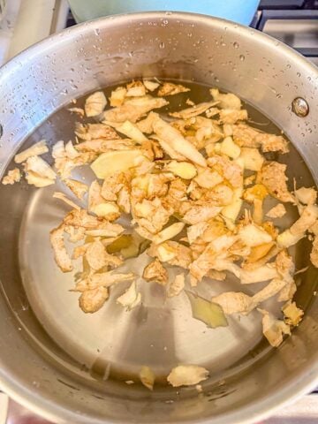 A pot of water with ginger peelings.